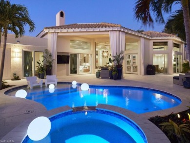 This exquisite villa, masterfully renovated in 2023 by The on Club at Pelican Bay Golf Course in Florida - for sale on GolfHomes.com, golf home, golf lot