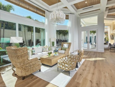 This exquisite villa, masterfully renovated in 2023 by The on Club at Pelican Bay Golf Course in Florida - for sale on GolfHomes.com, golf home, golf lot