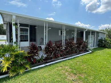 LOVELY DOUBLE-WIDE!  LARGE FRONT LANAI!  TURNKEY! FURNISHED on Wedgewood Golf Club in Florida - for sale on GolfHomes.com, golf home, golf lot