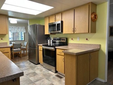LOVELY DOUBLE-WIDE!  LARGE FRONT LANAI!  TURNKEY! FURNISHED on Wedgewood Golf Club in Florida - for sale on GolfHomes.com, golf home, golf lot