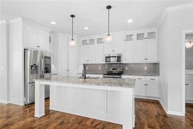 Rare END UNIT in maintenance-provided Staley Farms overlooking on Staley Farms Golf Club in Missouri - for sale on GolfHomes.com, golf home, golf lot