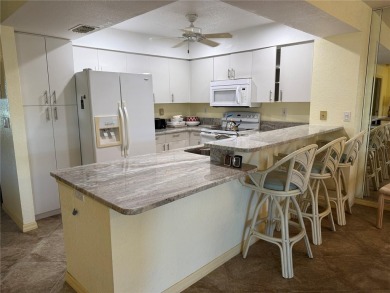 Impressive second floor light and bright END UNIT offers views on Saint Andrews South Golf Club in Florida - for sale on GolfHomes.com, golf home, golf lot