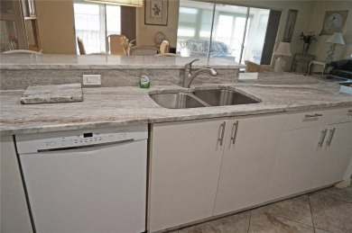 Impressive second floor light and bright END UNIT offers views on Saint Andrews South Golf Club in Florida - for sale on GolfHomes.com, golf home, golf lot