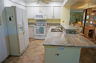 Impressive second floor light and bright END UNIT offers views on Saint Andrews South Golf Club in Florida - for sale on GolfHomes.com, golf home, golf lot