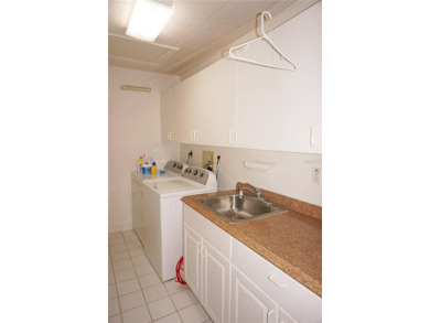 Impressive second floor light and bright END UNIT offers views on Saint Andrews South Golf Club in Florida - for sale on GolfHomes.com, golf home, golf lot