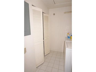 Impressive second floor light and bright END UNIT offers views on Saint Andrews South Golf Club in Florida - for sale on GolfHomes.com, golf home, golf lot