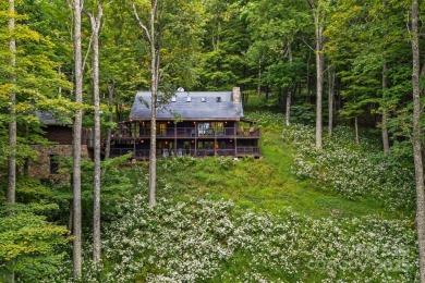 Secluded mountain cabin on three lots totaling 2.74 acres with on Wolf Laurel Country Club in North Carolina - for sale on GolfHomes.com, golf home, golf lot
