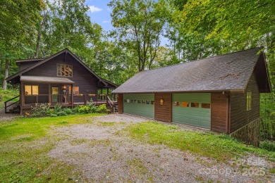 Secluded mountain cabin on three lots totaling 2.74 acres with on Wolf Laurel Country Club in North Carolina - for sale on GolfHomes.com, golf home, golf lot