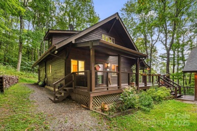 Secluded mountain cabin on three lots totaling 2.74 acres with on Wolf Laurel Country Club in North Carolina - for sale on GolfHomes.com, golf home, golf lot