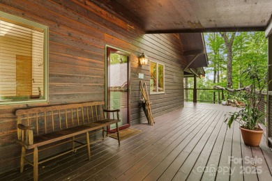 Secluded mountain cabin on three lots totaling 2.74 acres with on Wolf Laurel Country Club in North Carolina - for sale on GolfHomes.com, golf home, golf lot