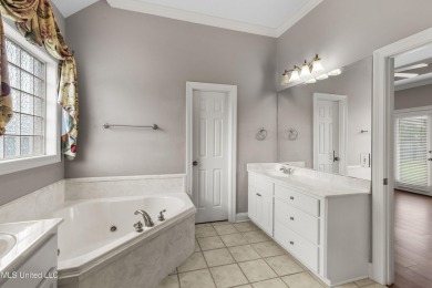 Welcome to this fantastic home on a spacious corner lot, just on Lake Caroline Golf Club in Mississippi - for sale on GolfHomes.com, golf home, golf lot