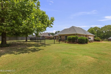 Welcome to this fantastic home on a spacious corner lot, just on Lake Caroline Golf Club in Mississippi - for sale on GolfHomes.com, golf home, golf lot