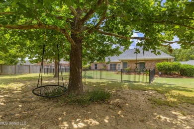 Welcome to this fantastic home on a spacious corner lot, just on Lake Caroline Golf Club in Mississippi - for sale on GolfHomes.com, golf home, golf lot