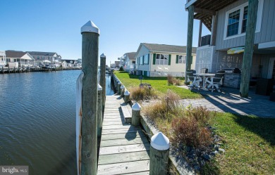 Waterfront coastal contemporary on a wide lagoon to Big on Bayside Resort Golf Club in Delaware - for sale on GolfHomes.com, golf home, golf lot