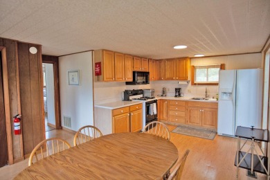 Cedar River Lodges are comprised of a Main Lodge, Guest Lodge on Cedar River Golf Course in New York - for sale on GolfHomes.com, golf home, golf lot