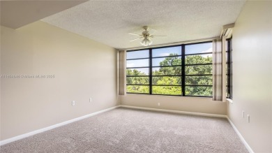 Stunning 2BR/2BA Corner Unit with Golf  Lake Views, Prime Davie on Pine Island Ridge Country Club in Florida - for sale on GolfHomes.com, golf home, golf lot