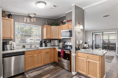 Welcome to this COMPLETELY UPDATED home in Orange Blossom, The on Orange Blossom Hills Golf and Country Club in Florida - for sale on GolfHomes.com, golf home, golf lot