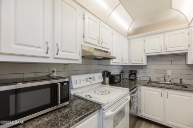 Welcome to your beautiful, turn-key beach escape in Daytona on Oceans Golf Club in Florida - for sale on GolfHomes.com, golf home, golf lot