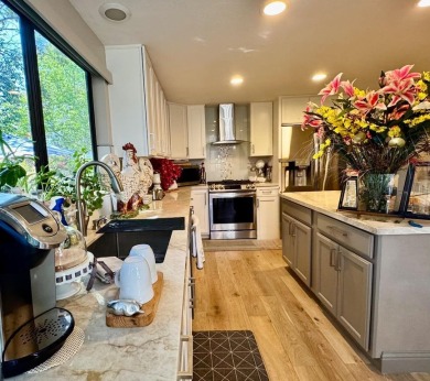 Located on a scenic cul-de-sac, this beautifully renovated home on Villages Golf and Country Club in California - for sale on GolfHomes.com, golf home, golf lot