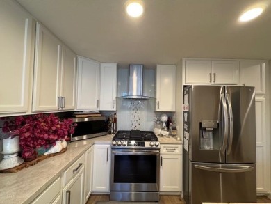 Located on a scenic cul-de-sac, this beautifully renovated home on Villages Golf and Country Club in California - for sale on GolfHomes.com, golf home, golf lot