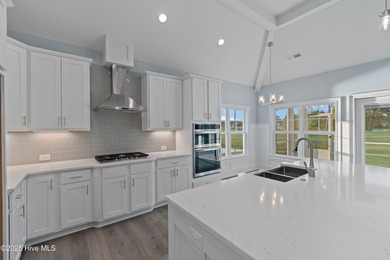 This brand new Riptide home with stunning setting and finishes on Sea Trail Golf Resort in North Carolina - for sale on GolfHomes.com, golf home, golf lot