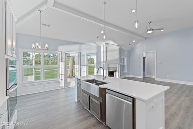 This brand new Riptide home with stunning setting and finishes on Sea Trail Golf Resort in North Carolina - for sale on GolfHomes.com, golf home, golf lot