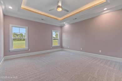 This brand new Riptide home with stunning setting and finishes on Sea Trail Golf Resort in North Carolina - for sale on GolfHomes.com, golf home, golf lot