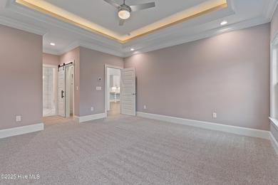 This brand new Riptide home with stunning setting and finishes on Sea Trail Golf Resort in North Carolina - for sale on GolfHomes.com, golf home, golf lot