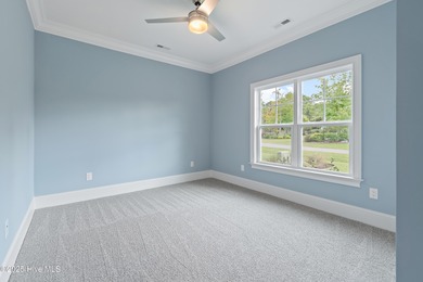 This brand new Riptide home with stunning setting and finishes on Sea Trail Golf Resort in North Carolina - for sale on GolfHomes.com, golf home, golf lot