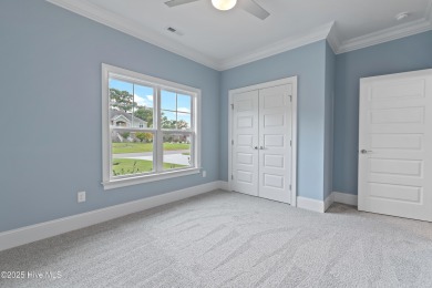 This brand new Riptide home with stunning setting and finishes on Sea Trail Golf Resort in North Carolina - for sale on GolfHomes.com, golf home, golf lot