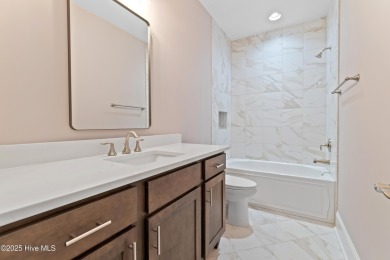 This brand new Riptide home with stunning setting and finishes on Sea Trail Golf Resort in North Carolina - for sale on GolfHomes.com, golf home, golf lot