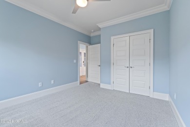 This brand new Riptide home with stunning setting and finishes on Sea Trail Golf Resort in North Carolina - for sale on GolfHomes.com, golf home, golf lot