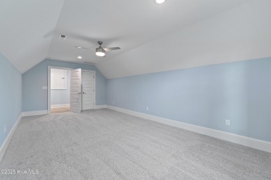 This brand new Riptide home with stunning setting and finishes on Sea Trail Golf Resort in North Carolina - for sale on GolfHomes.com, golf home, golf lot