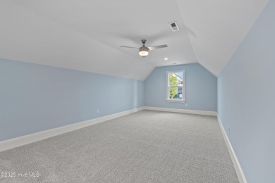This brand new Riptide home with stunning setting and finishes on Sea Trail Golf Resort in North Carolina - for sale on GolfHomes.com, golf home, golf lot