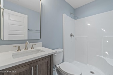 This brand new Riptide home with stunning setting and finishes on Sea Trail Golf Resort in North Carolina - for sale on GolfHomes.com, golf home, golf lot
