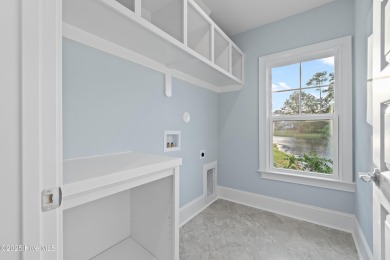 This brand new Riptide home with stunning setting and finishes on Sea Trail Golf Resort in North Carolina - for sale on GolfHomes.com, golf home, golf lot