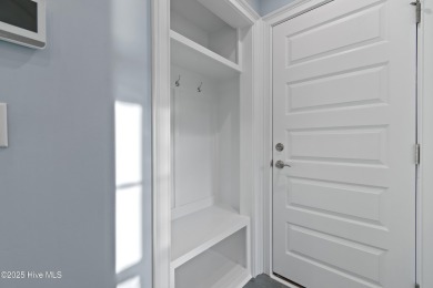 This brand new Riptide home with stunning setting and finishes on Sea Trail Golf Resort in North Carolina - for sale on GolfHomes.com, golf home, golf lot