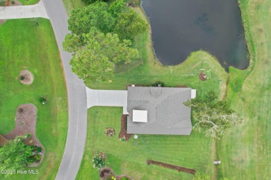 This brand new Riptide home with stunning setting and finishes on Sea Trail Golf Resort in North Carolina - for sale on GolfHomes.com, golf home, golf lot