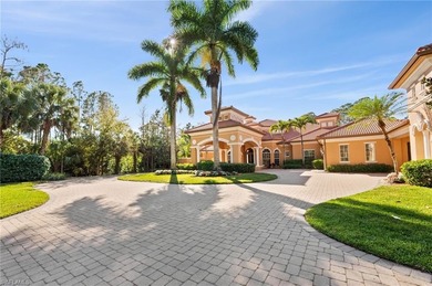 Discover refined living in this custom-built, two-story estate on Naples National Golf Club in Florida - for sale on GolfHomes.com, golf home, golf lot
