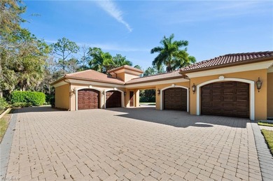 Discover refined living in this custom-built, two-story estate on Naples National Golf Club in Florida - for sale on GolfHomes.com, golf home, golf lot