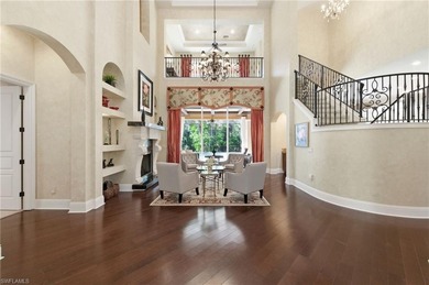 Discover refined living in this custom-built, two-story estate on Naples National Golf Club in Florida - for sale on GolfHomes.com, golf home, golf lot