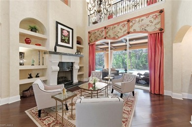 Discover refined living in this custom-built, two-story estate on Naples National Golf Club in Florida - for sale on GolfHomes.com, golf home, golf lot