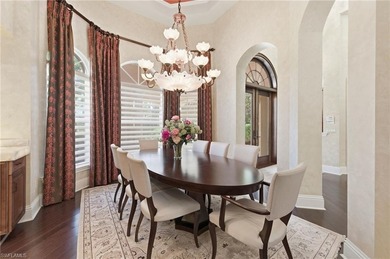 Discover refined living in this custom-built, two-story estate on Naples National Golf Club in Florida - for sale on GolfHomes.com, golf home, golf lot