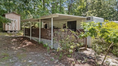 LOCATION!! LOCATION!! Lots of Potential for This Level Camp Lot on River Golf and County Club at Lake Royale in North Carolina - for sale on GolfHomes.com, golf home, golf lot