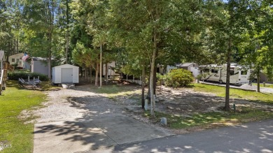 LOCATION!! LOCATION!! Lots of Potential for This Level Camp Lot on River Golf and County Club at Lake Royale in North Carolina - for sale on GolfHomes.com, golf home, golf lot
