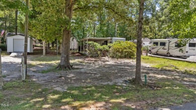LOCATION!! LOCATION!! Lots of Potential for This Level Camp Lot on River Golf and County Club at Lake Royale in North Carolina - for sale on GolfHomes.com, golf home, golf lot