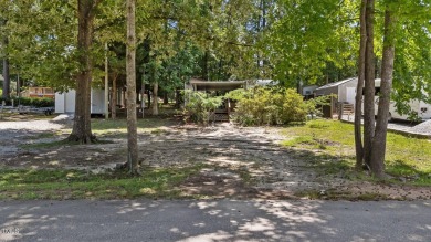 LOCATION!! LOCATION!! Lots of Potential for This Level Camp Lot on River Golf and County Club at Lake Royale in North Carolina - for sale on GolfHomes.com, golf home, golf lot