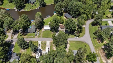 LOCATION!! LOCATION!! Lots of Potential for This Level Camp Lot on River Golf and County Club at Lake Royale in North Carolina - for sale on GolfHomes.com, golf home, golf lot