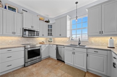 Imagine waking up to breathtaking water views every day in this on Saint Andrews South Golf Club in Florida - for sale on GolfHomes.com, golf home, golf lot