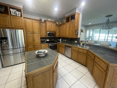 Located in the desirable Pelican Point Golf Community, this on Pelican Point Golf Club in Louisiana - for sale on GolfHomes.com, golf home, golf lot